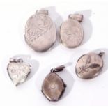 Hallmarked silver hinged oval locket, together with four white metal small examples