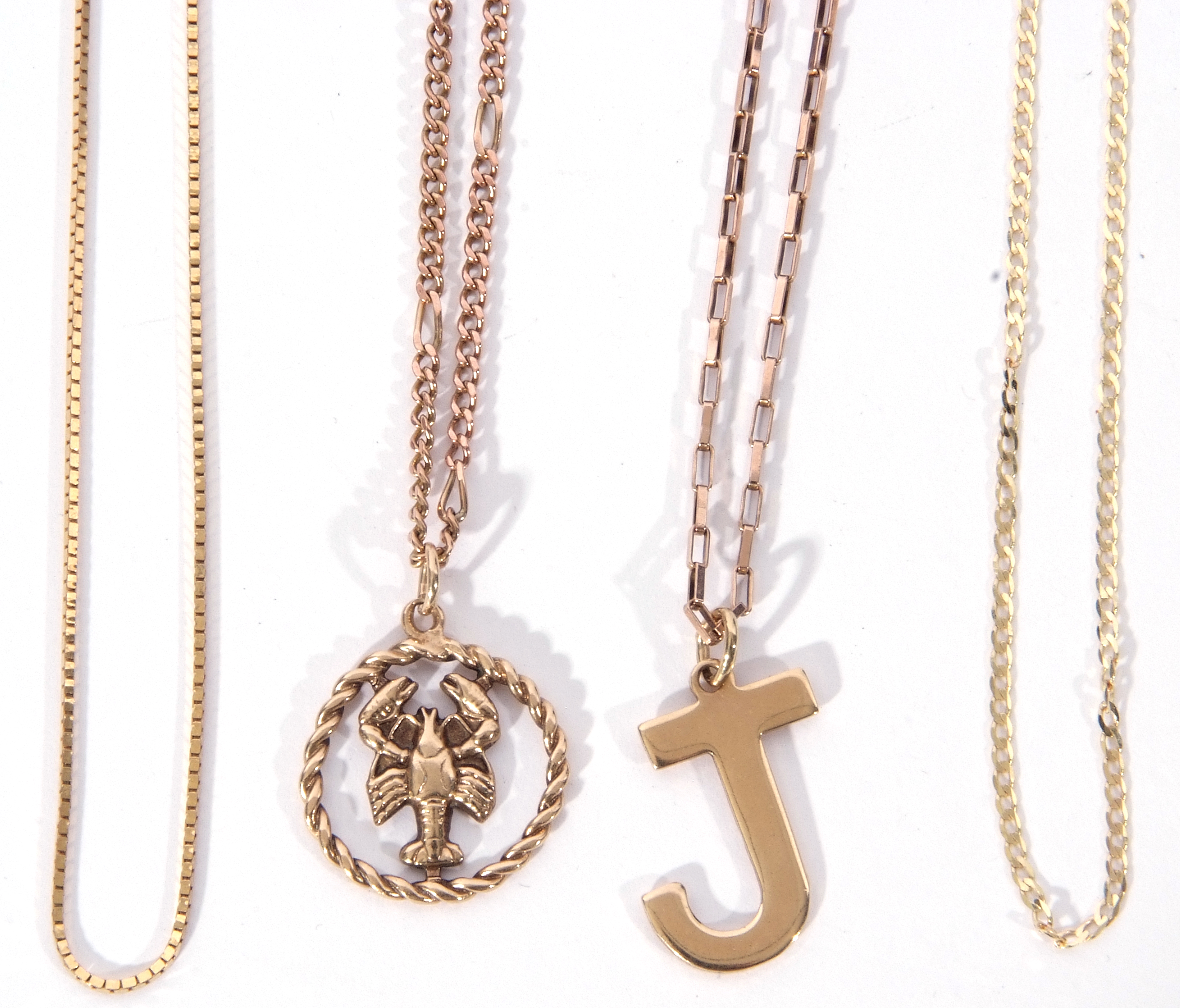 Mixed Lot: 9ct gold letter 'J' pendant on a 9ct gold oval link chain, a 9ct gold zodiac pendant '