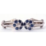 Pair of precious metal, diamond and sapphire cluster earrings, each centring a small brilliant cut