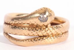 Early 20th century 18ct gold and diamond serpent ring, the head set with a small old cut diamond,