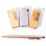 Mixed Lot: two Dunhill lighters, a ribbed example with patent no USRE24163, a cricket vintage