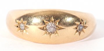 Antique 18ct gold three stone diamond ring featuring three small graduated mixed old cut diamonds,