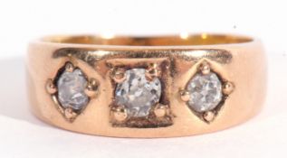 Antique three stone diamond ring featuring three graduated old cut diamonds, each individually in