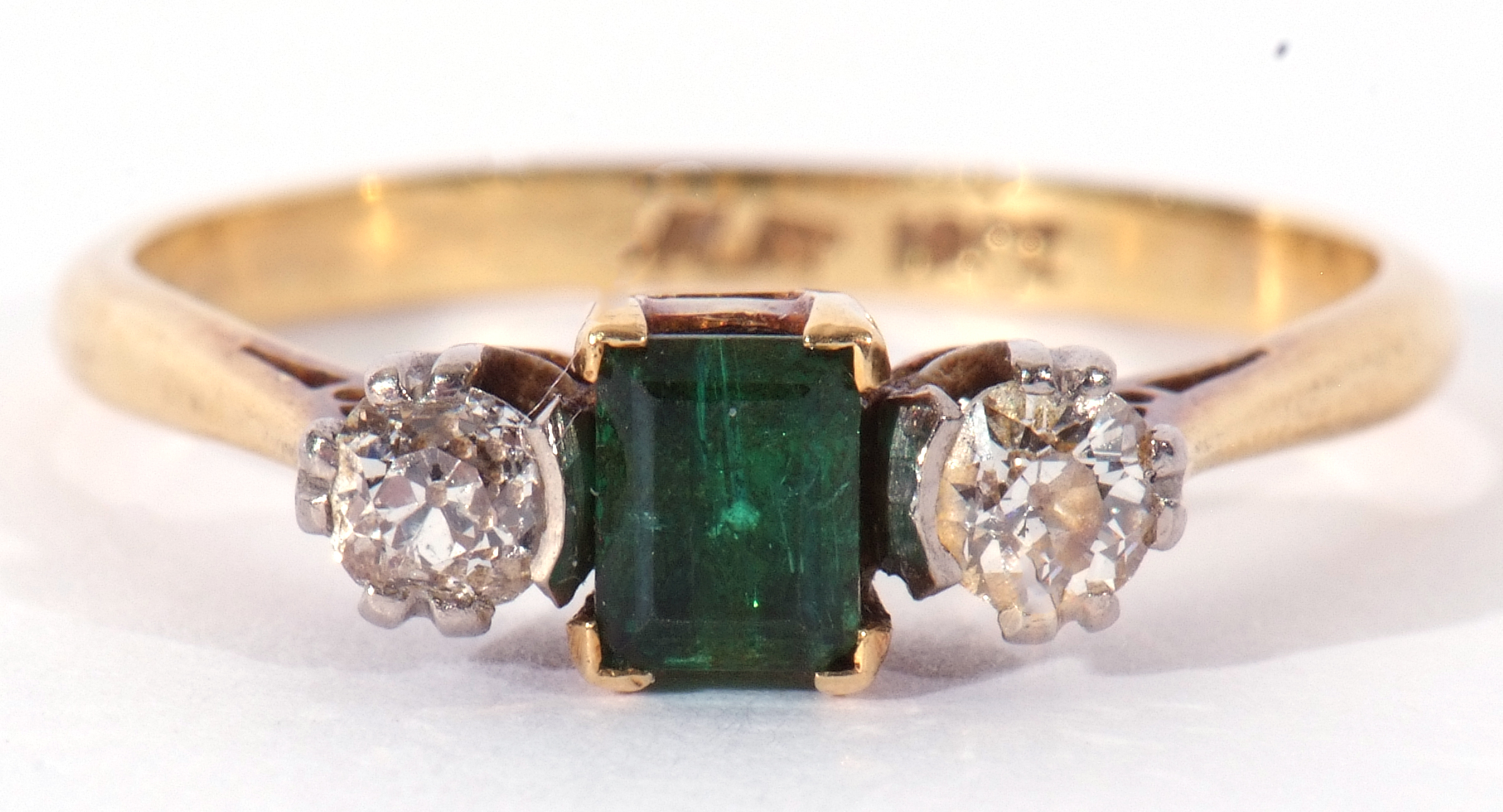 Emerald and diamond three stone ring, the step cut emerald 4.3mm x 3mm, flanked by two round - Image 2 of 9