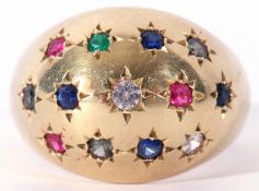 Mid-grade yellow metal multi-gem set ring of dome shaped design featuring star engraved small stones