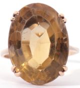 9ct gold lemon citrine ring, the oval faceted citrine 20 x 14mm, raised in a basket mount, size Q (