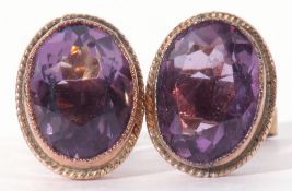 Pair of amethyst earrings of oval faceted shape in millegrain edge cut down setting, 10 x 6mm, 9ct