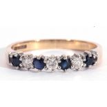 Modern 9ct gold diamond and sapphire ring, alternate set with four small round sapphires and three