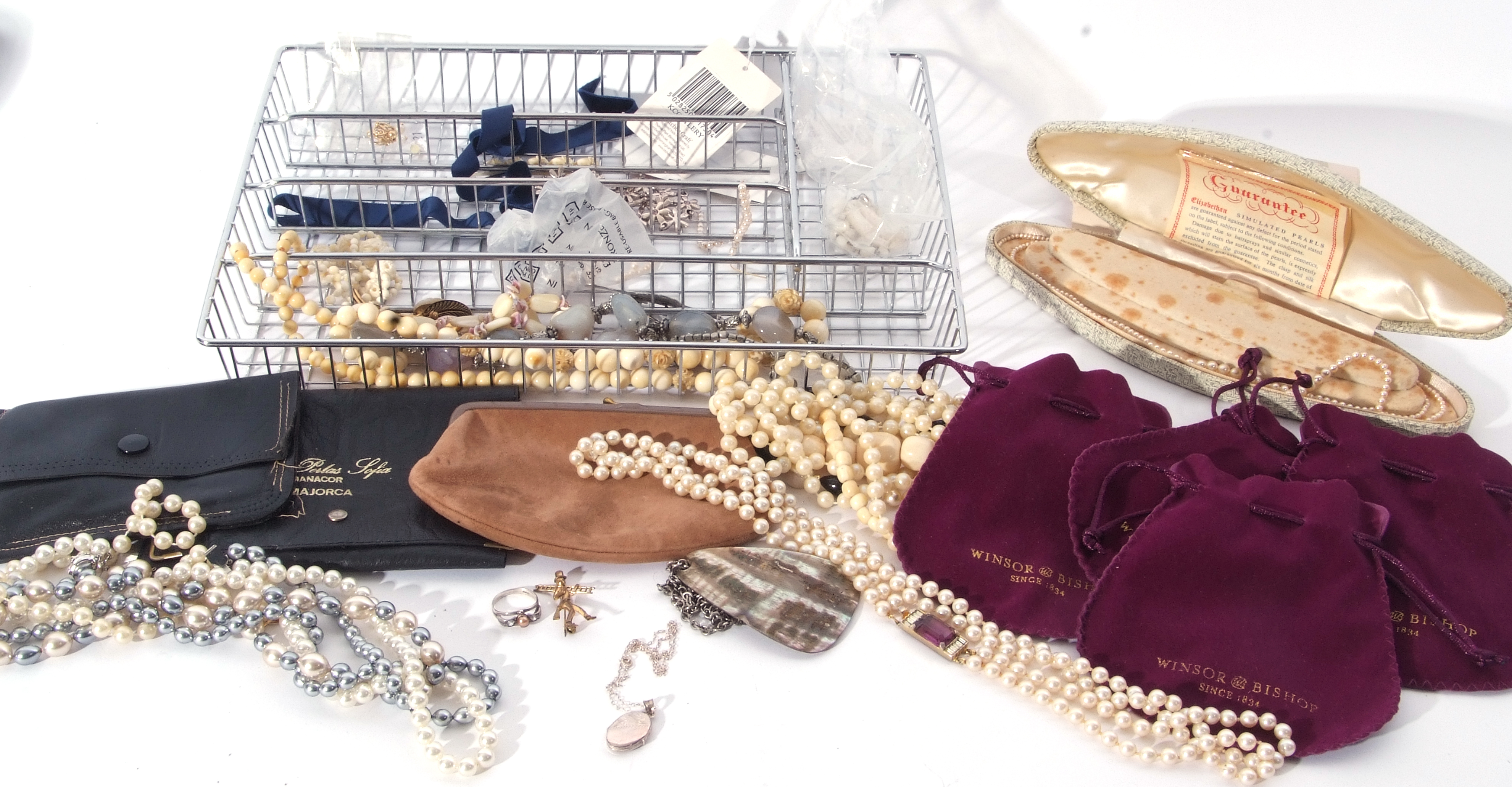 Tray of costume jewellery to include necklaces, brooches and four Winsor Bishop jewellery bags (