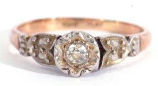 Diamond single stone ring featuring a small old cut diamond in illusion setting raised between