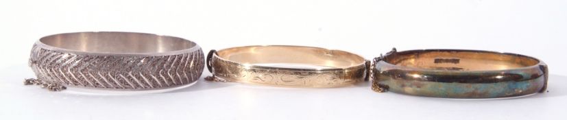 Mixed Lot: rolled gold hinged bracelet, a silver gilt hinged bracelet, together with a filigree