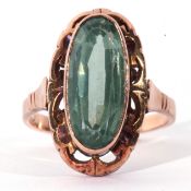 Large lozenge shaped green stone dress ring, the centre with a green coloured stone 16 x 7mm, raised