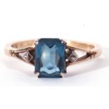 Modern blue stone ring set between two marcasite set shoulders, stamped 9ct and silver, size N