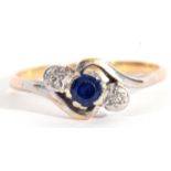 Sapphire and diamond cross over ring, the round shape faceted sapphire between two small single