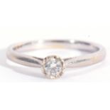 Modern 9ct white gold and single stone diamond ring featuring a round brilliant cut diamond, 0.