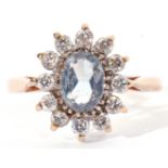 9ct gold and paste set cluster ring, the light blue coloured centre stone surrounded by 12 small