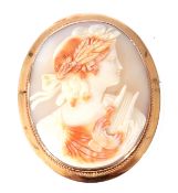 Large oval carved shell cameo depicting a Bacchanalian lady, 6 x 5cm, framed in a 14K stamped mount