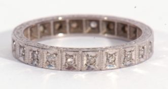 Precious metal and diamond full eternity ring with 22 small single cut diamonds, both edges with