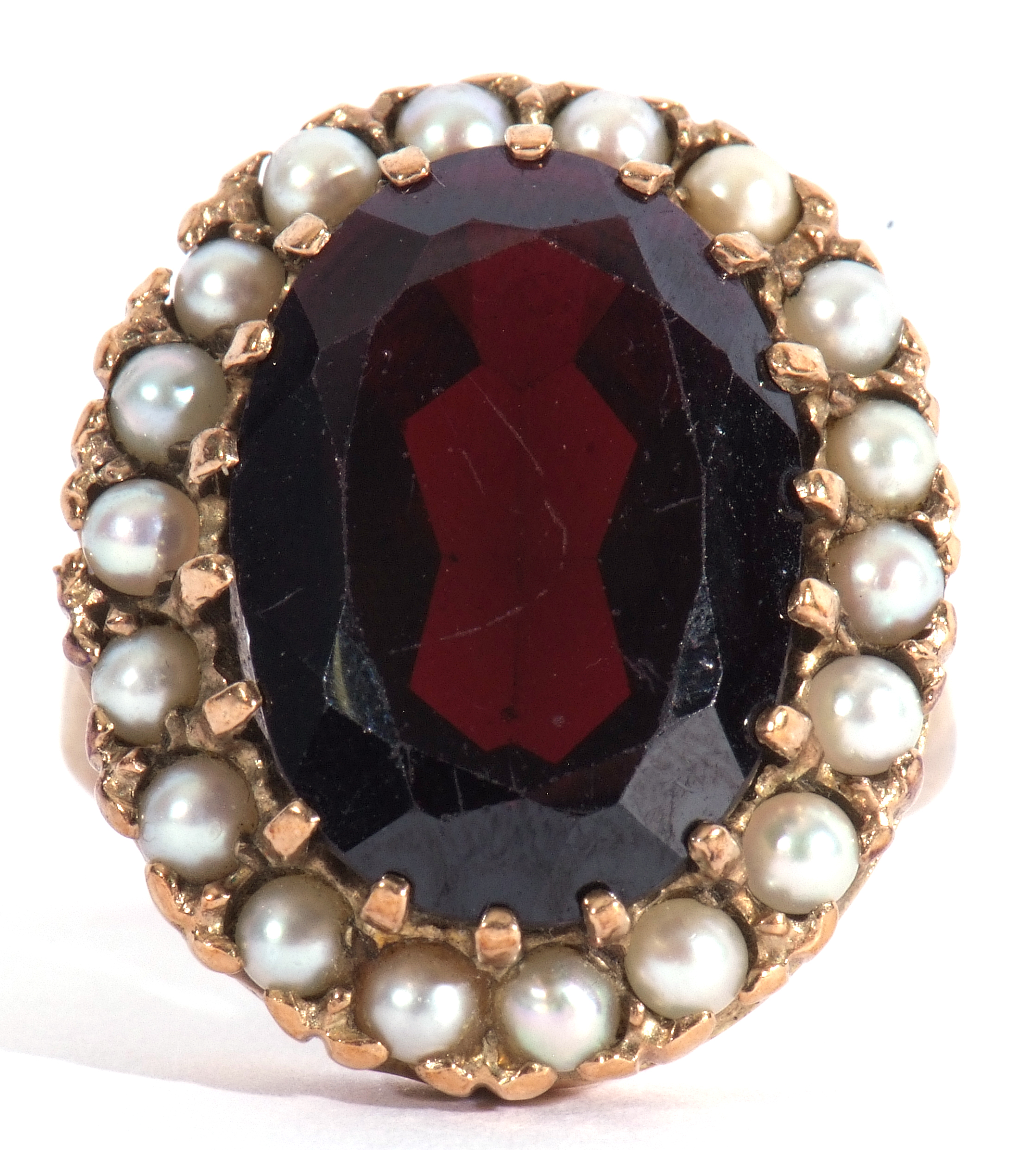 Modern 9ct gold dress ring, a large red paste faceted stone, 18 x 12mm, within a seed pearl