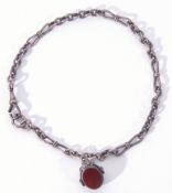 Antique silver watch chain with bow and oval shaped links, suspending a carnelian double sided