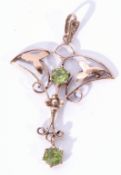 Modern 9ct gold open work pendant decorated with two small round green stones, 3.5 x 2.5cm