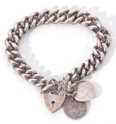 Hallmarked silver curb link bracelet with heart padlock and coin fitting, 55.5gms