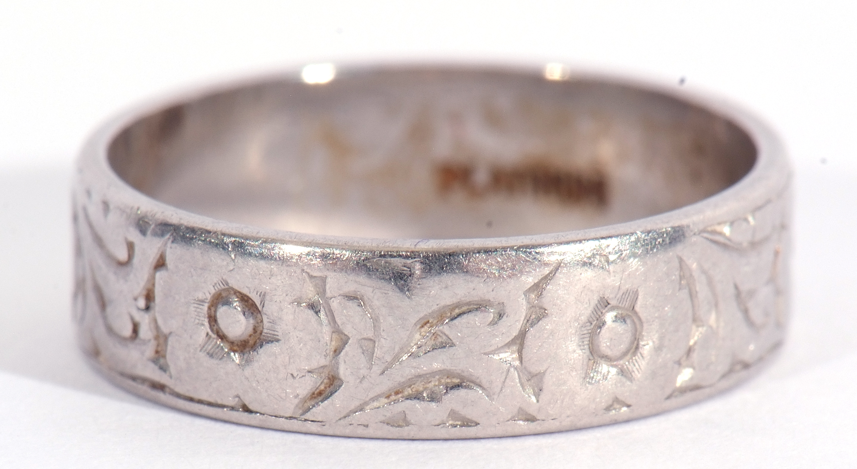 Platinum band with chased and engraved detail, 5.8gms, size L/M