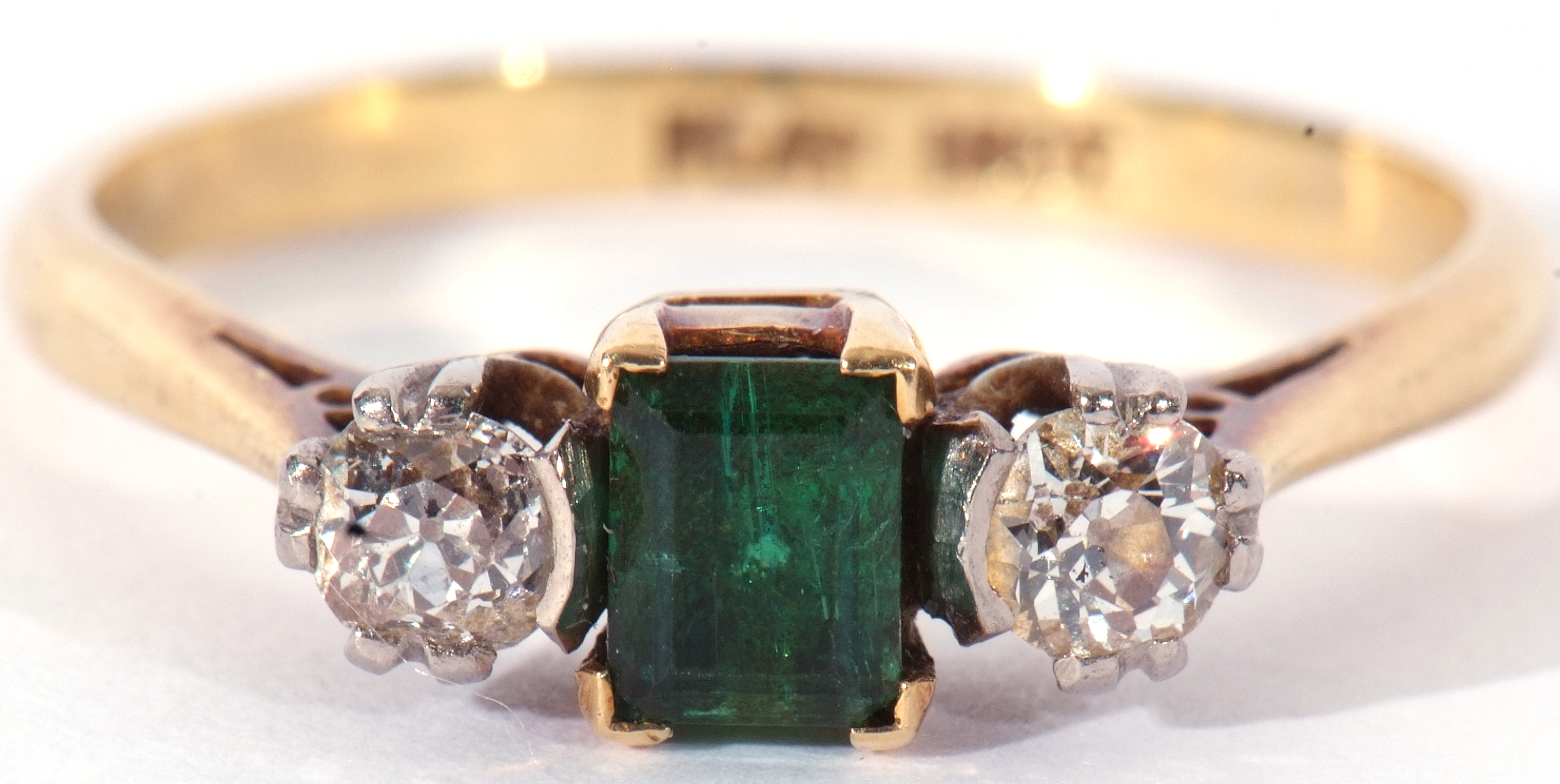 Emerald and diamond three stone ring, the step cut emerald 4.3mm x 3mm, flanked by two round - Image 9 of 9