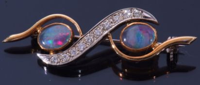 Precious metal opal and diamond brooch, the stylised design with two opal doublets between a