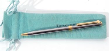 Tiffany & Co stainless steel ballpoint pen with gilt metal T-shaped clip and mounts, engraved '