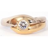 18ct gold brilliant cut solitaire diamond ring, the bezel set diamond raised above two-tone cross