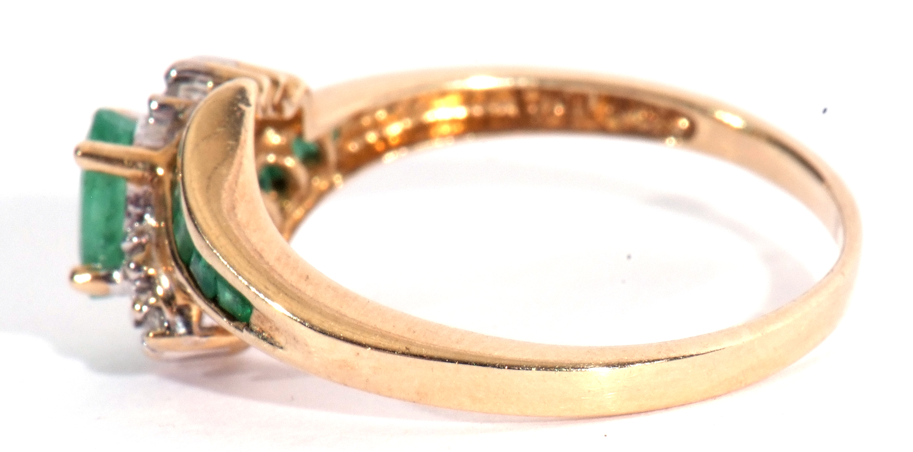 Modern 10K stamped diamond and synthetic emerald cluster ring, centring an oval faceted stone - Image 3 of 7