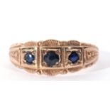 9ct gold three stone sapphire ring featuring three graduated round shaped small sapphires, each