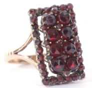 Vintage garnet ring of rectangular shape, 18 x 10mm and decorated with two tiers of graduated