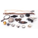 Mixed Lot: three antique jet brooches, five paste rings, a child's silver framed mirror (a/f) etc