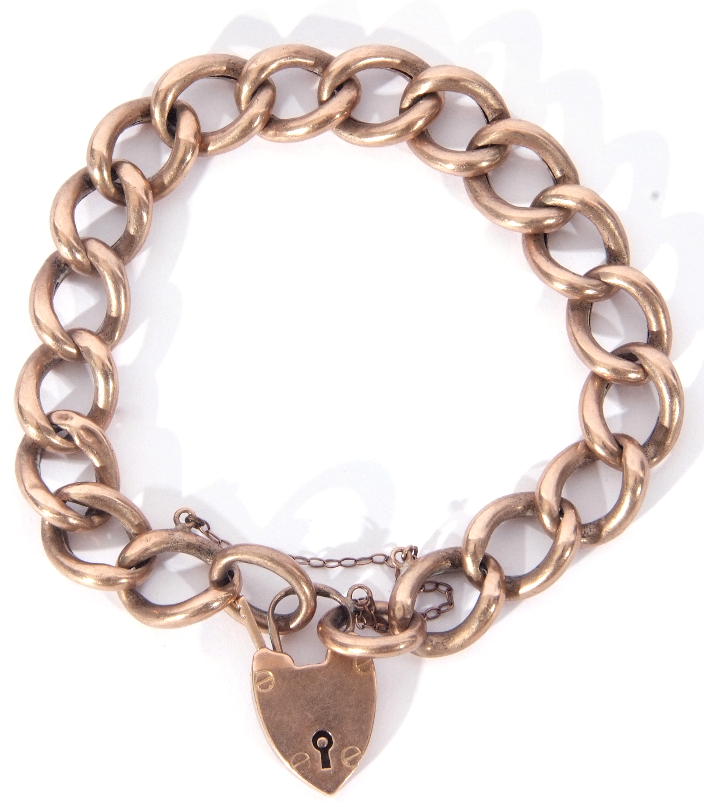 9ct stamped large curb link bracelet to a heart padlock and safety chain fitting, 15gms