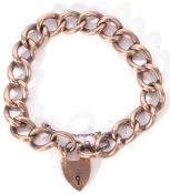 9ct stamped large curb link bracelet to a heart padlock and safety chain fitting, 15gms