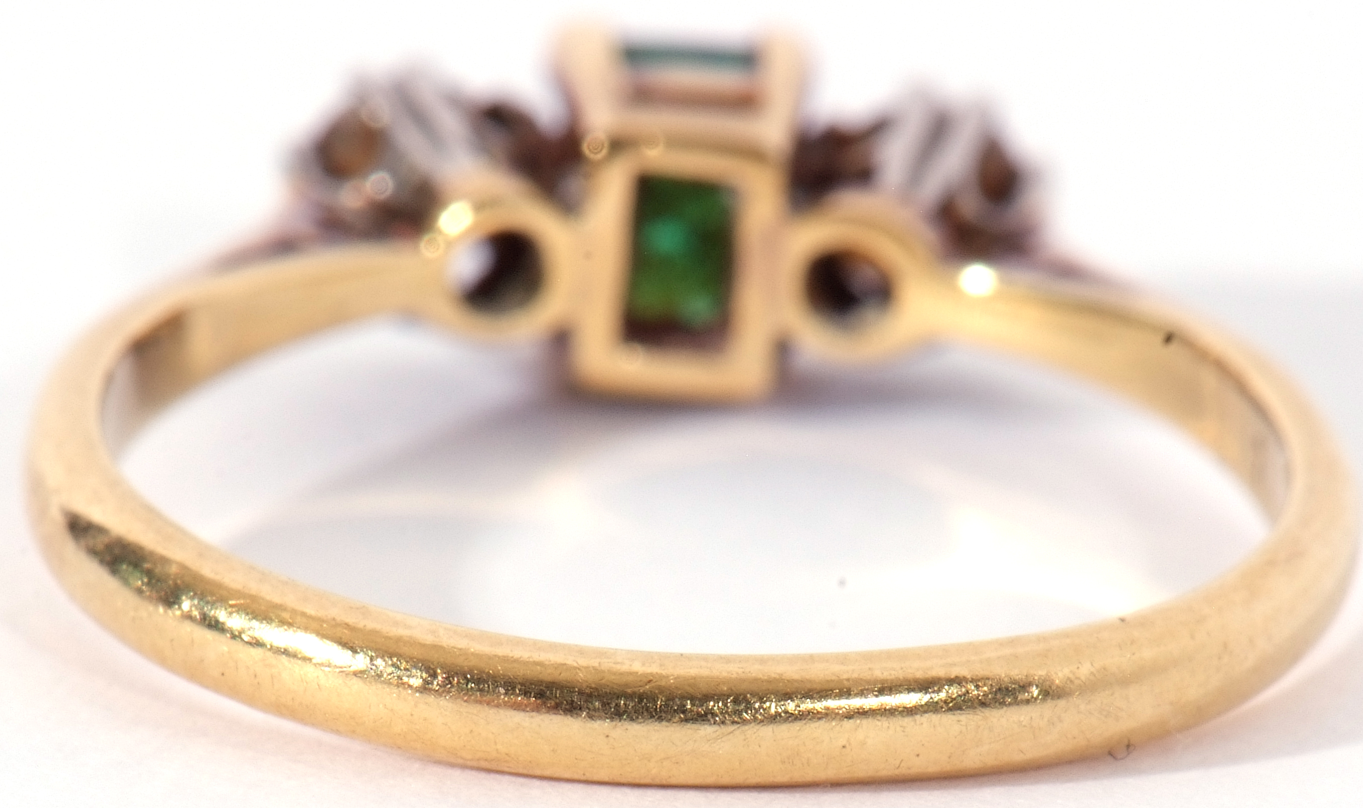 Emerald and diamond three stone ring, the step cut emerald 4.3mm x 3mm, flanked by two round - Image 6 of 9