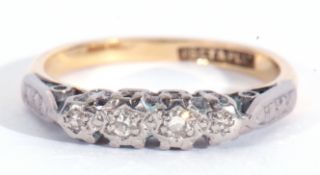 18ct and Plat stamped four stone diamond ring featuring four small single cut diamonds, each