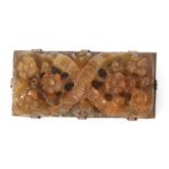 Vintage carved amber brooch of rectangular form, pierced and carved with garlands of flowers on a