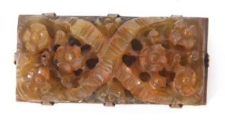 Vintage carved amber brooch of rectangular form, pierced and carved with garlands of flowers on a