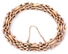 Antique 9ct stamped gate bracelet, a three-bar gate link design joined by mesh work design links,
