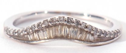 Modern precious metal diamond wishbone ring set with baguette and single stone diamonds, stamped