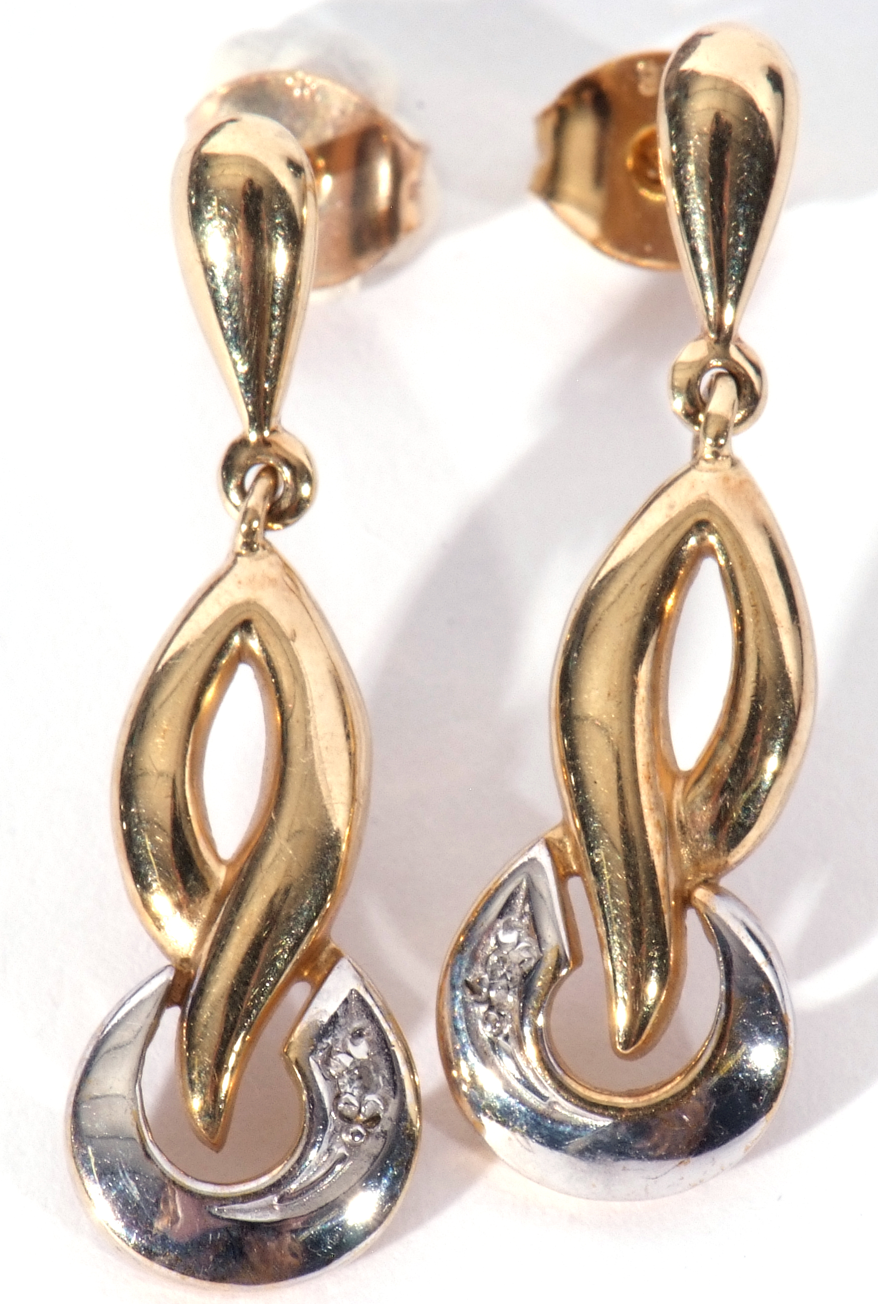 Pair of modern 9ct two-tone gold earrings in a stylised design, each highlighted with a small single - Image 2 of 7