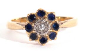 Sapphire and diamond cluster ring centring a small single cut diamond within a surround of eight