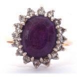 18ct gold, amethyst and diamond cluster ring, the large central oval faceted amethyst 12 x 10mm,