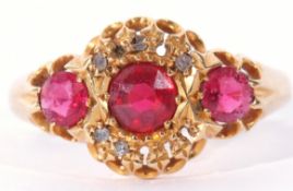 18ct gold red and pink three stone ring, highlighted with five small diamonds (five missing), 3.5gms