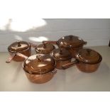 FIVE GLASS SAUCEPANS