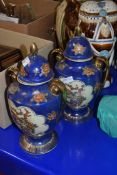 PAIR OF 20TH CENTURY CHINESE DOUBLE HANDLED COVERED VASES