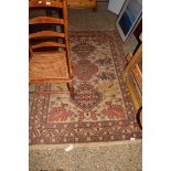 20TH CENTURY CAUCASIAN WOOL FLOOR RUG, DECORATED WITH LARGE CENTRAL PANEL OF MEDALLIONS AND